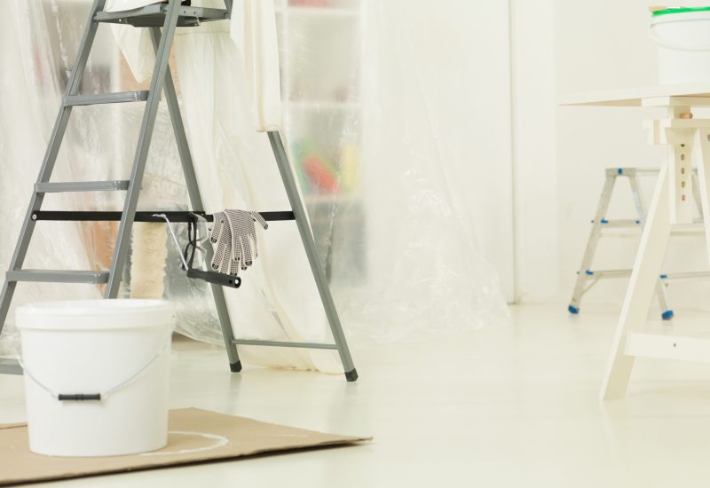 Construction brush, roller, aluminium ladder. The renovation of the house. home repairs. construction tools, products. Bright white apartment renovation.